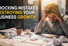 "Frustrated small business owner with charts and graphs illustrating declining business growth."