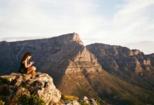 A quiet moment on Table Mountain as a young woman takes in the South African view